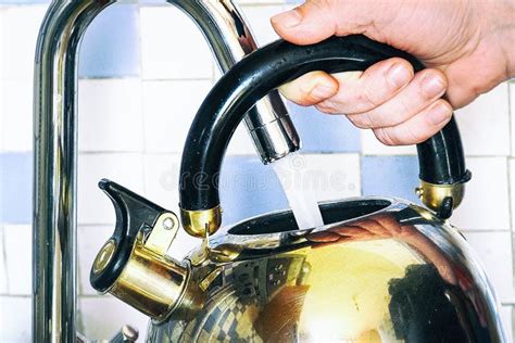 Pours Water Into A Kettle From A Tap Stock Photo Image Of Scent