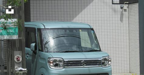 A Small Blue Van Parked In Front Of A Building Photo Free Japan Image