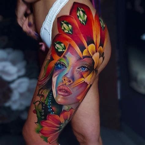 a woman's leg with colorful tattoos on it