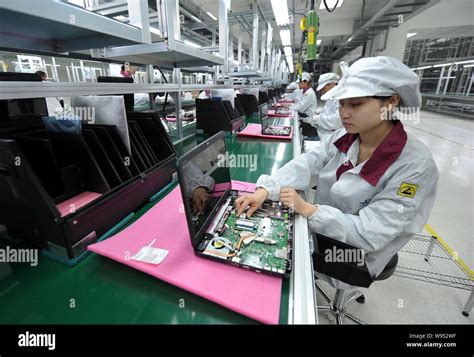 File Chinese Factory Workers Assemble Laptop Computers At The Plant