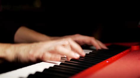 Playing a keyboard close up on hands 14062088 Stock Video at Vecteezy