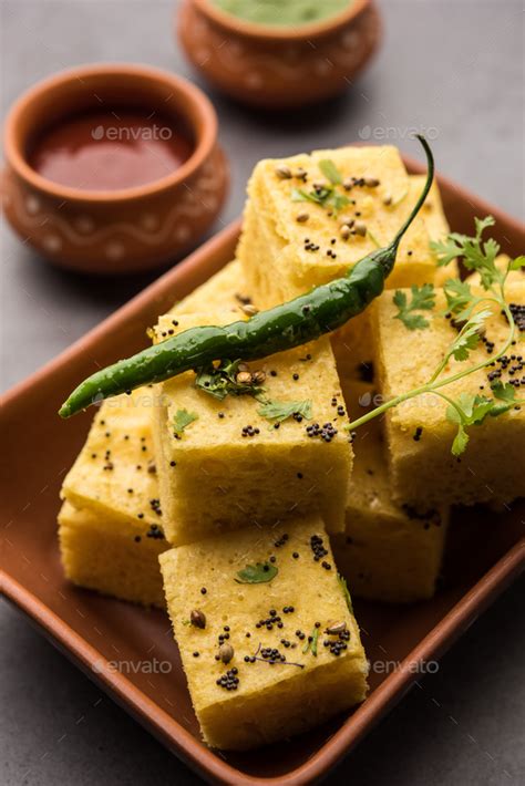 Gujarati Khaman Dhokla Or Steamed Gram Flour Puffy Snack Cake Stock