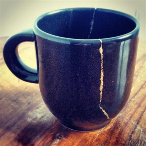 Black Coffee Cup Broken And Repaired With Gold Kintsugi Fotografie