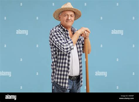 Mature Farmer Posing On Blue Background Stock Photo Alamy