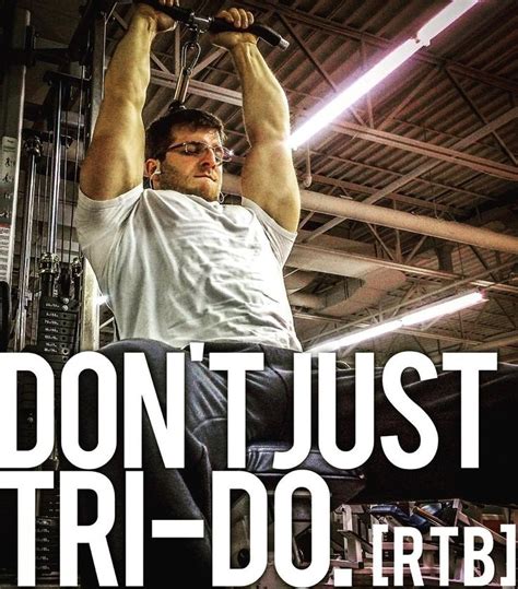 A Man Is Doing Pull Ups In A Gym With The Words Don T Just Tri Do It