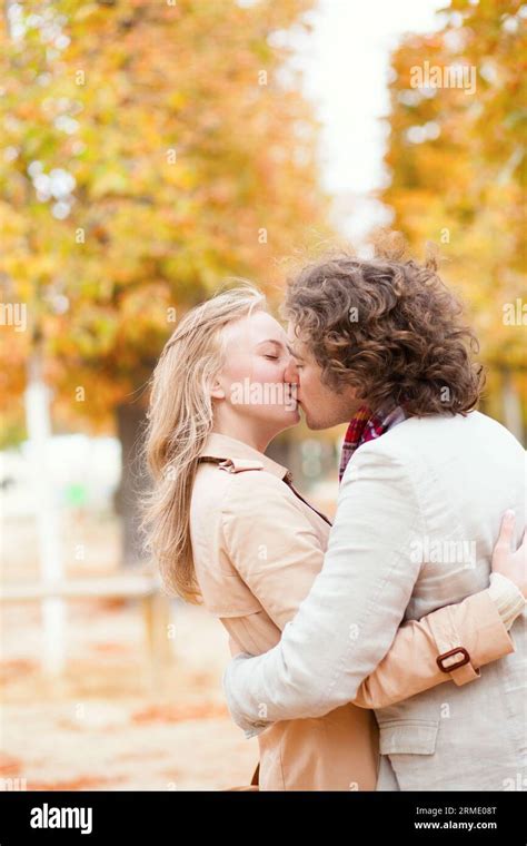 Romantic Couple Kissing On A Fall Day Stock Photo Alamy