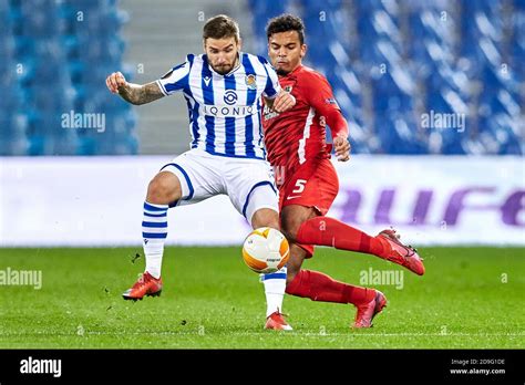 Cristian Portugues Portu Of Real Sociedad And Owen Wijndal Of AZ