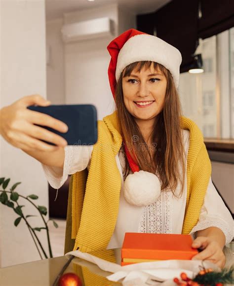 Happy Young Woman Taking A Selfie At Christmas Holiday At Home