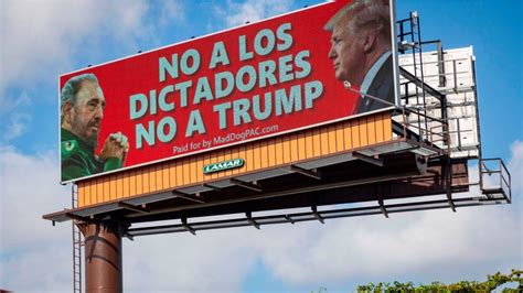 A Group Of Cubans Protest In Miami Against A Billboard That Compares