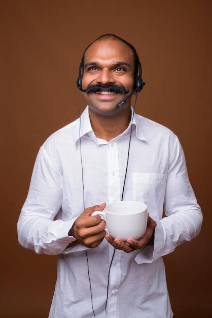 Premium Photo Portrait Of Smiling Man Holding Ice Cream