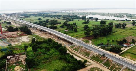 Construction of road approaches to rail cum road bridge across river ...