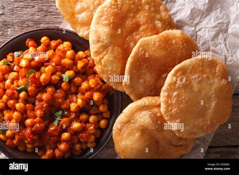 Indian Chana Masala And Puri Bread Close Up On The Table Horizontal