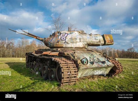 Target tank with graffiti on a meadow Stock Photo - Alamy