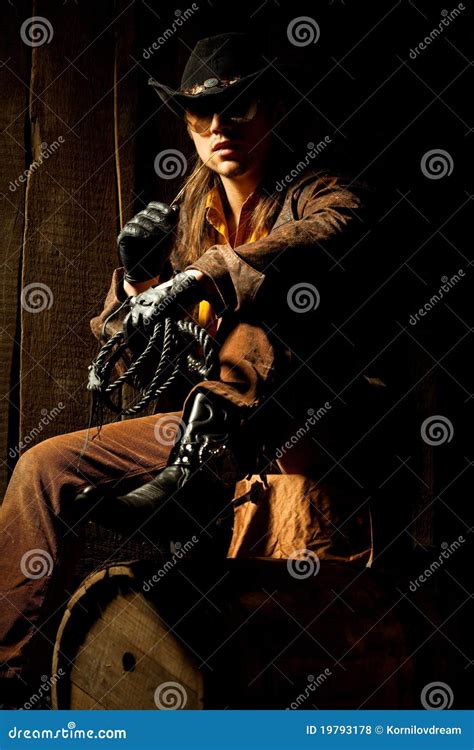 Cowboy With Black Leather Flogging Whip Royalty Free Stock Photos