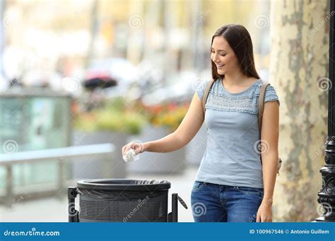 Civic Woman Throwing A Paper Into A Trash Bin Stock Photo Image Of