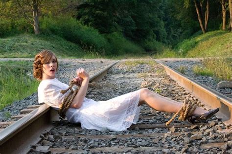 Woman Tied To Train Tracks