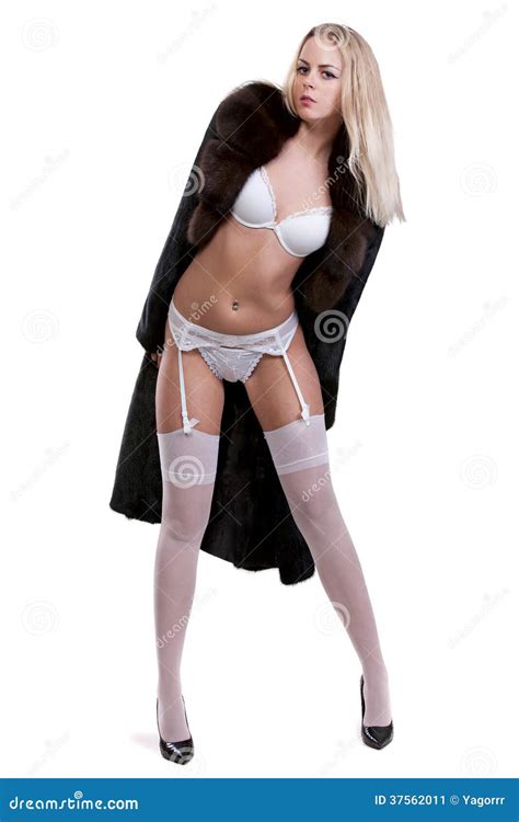 Beautiful Girl In Lingerie And Fur Coat Isolation On White Back Stock