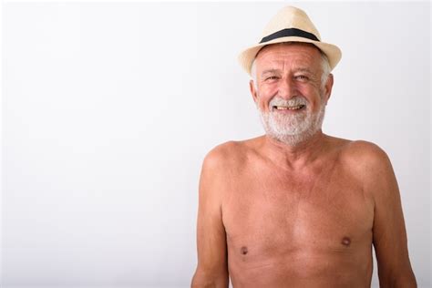 Premium Photo Happy Senior Bearded Man Smiling While Wearing Hat