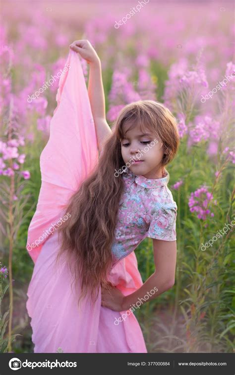 Little Girl Pink Flower — Stock Photo © Rotanova #377000884