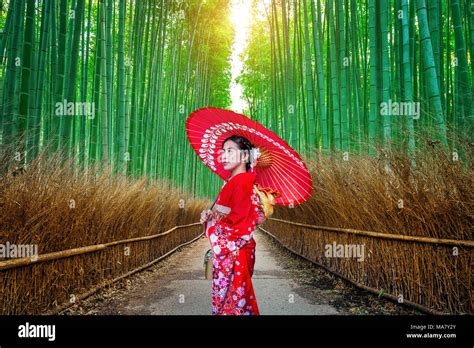 Bamboo Forest Asian Woman Wearing Japanese Traditional Kimono At