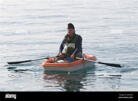 Old Man In Rowing Boat Boats Oars Oar Retirement Retire Pension Stock