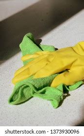 Hand Yellow Rubber Glove Washing Surface Stock Photo 1373930096