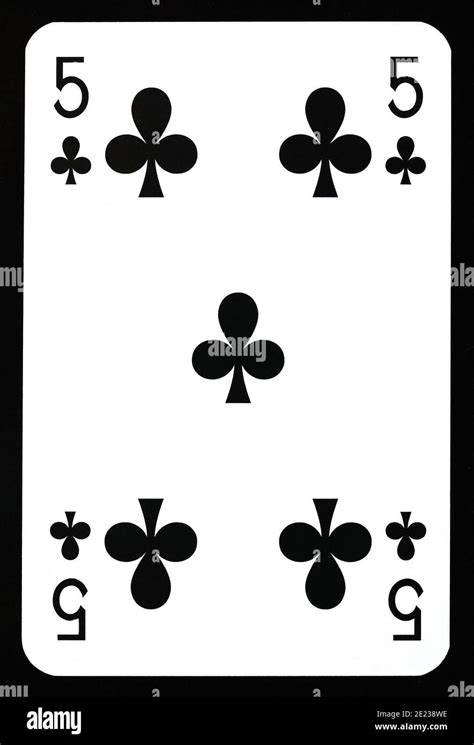 Five of clubs playing card isolated on black Stock Photo - Alamy