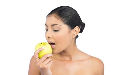 Premium Photo Calm Nude Brunette Eating Green Apple