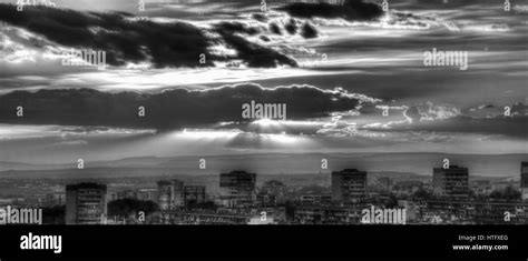 Sunset over city in black and white Stock Photo - Alamy