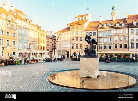 Famous Mermaid Statue With Historic Colorful Houses At Old Town Market