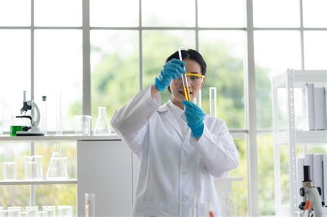 Premium Photo | Portrait of scientist performing experiment in laboratory