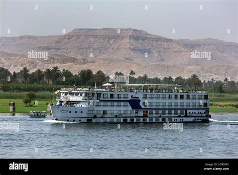 A Floating Hotel Moves Along The River Nile From Luxor Towards The Esna