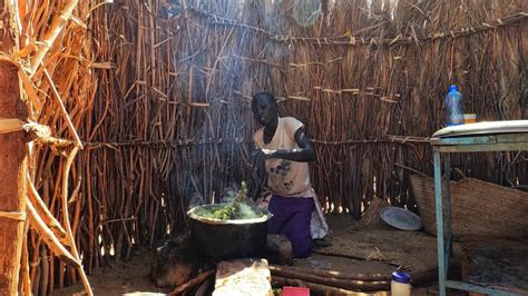 Cooking African Traditional Village Food Fingerlings With Maize Flour