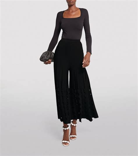 Alaïa black Geometric Ruffle Wide Leg Trousers Harrods UK