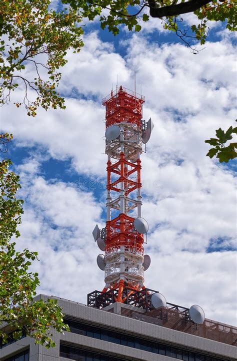 A Cell Tower Framed with Green Leaves. Nagoya. Japan Stock Photo ...