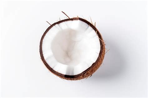 Premium Ai Image Fresh Coconut Pieces Artistically Arranged On A Pristine White Background