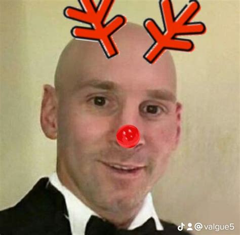 A Bald Man With Red Nose And Antlers On His Head