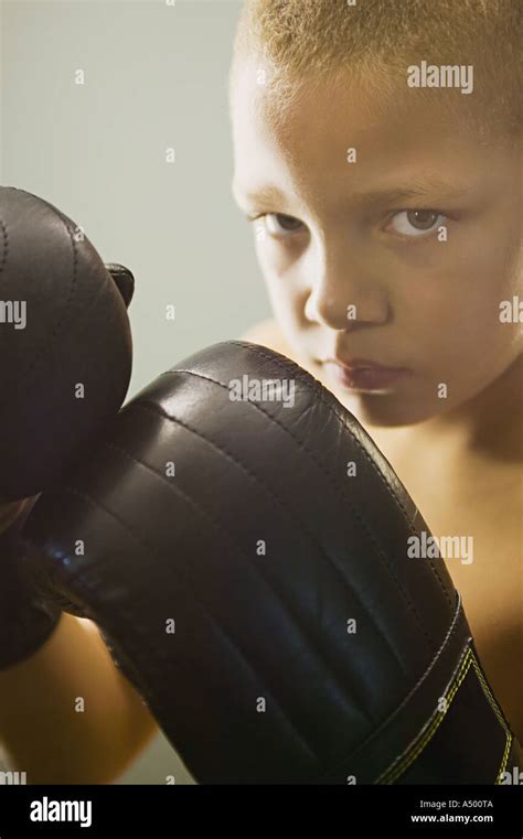 Boy wearing boxing gloves Stock Photo - Alamy