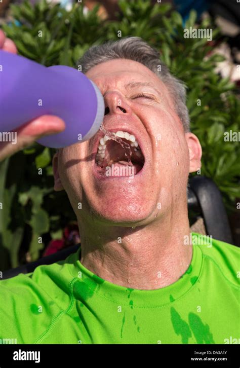 Athlete Drinking from Water Bottle Stock Photo - Alamy