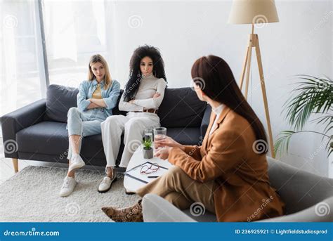 Lesbians Sitting Legs Crossed Breakfast In Bed Talking Smiling