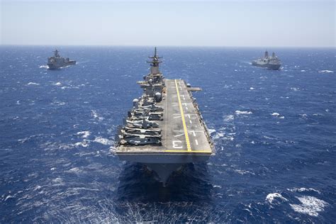 The Amphibious Assault Ship Uss Kearsarge Lhd 3 Center Leads The