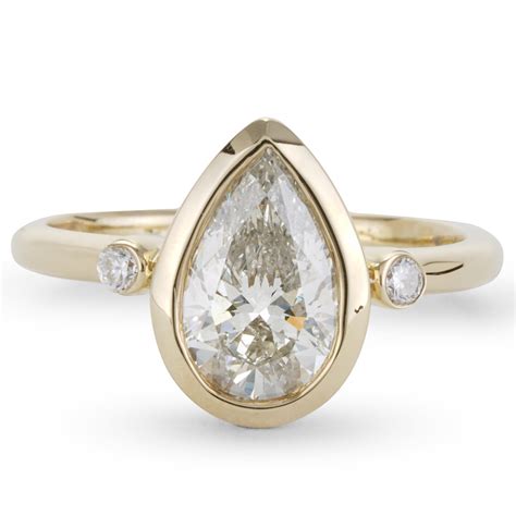 Ct Bezel Set Pear Center Engagement Ring In Yellow Gold New York