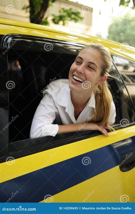 Happy Female Passenger Inside Of A Taxi Royalty Free Stock Photo