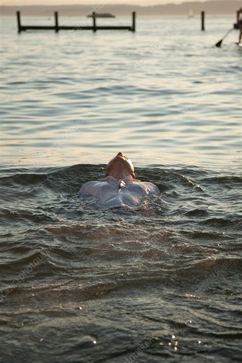 Person Floating On Water