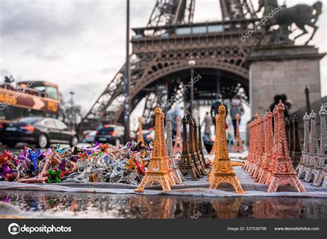 Eiffel tower souvenirs with a real Eiffel tower in the background ...