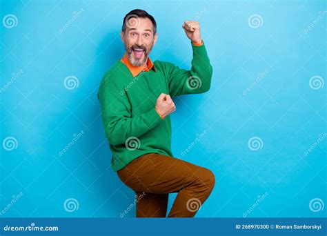 Photo Of Overjoyed Delighted Person Raise Fists Accomplishment Shout