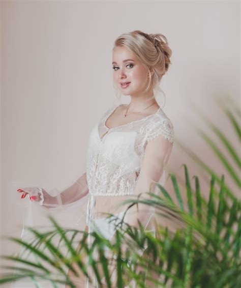 Premium Photo Beautiful Blonde Bride In A Wedding Gown In The Room Morning Of The Bride And