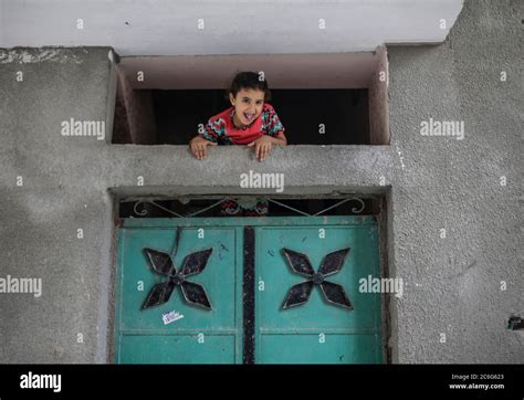 Gaza City, The Gaza Strip, Palestine. 6th July, 2020. Palestinian children play outside their ...