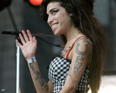 Amy Winehouse Tattoos ~ Lizard Tattoo