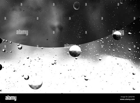 Abstract Backdrop With Oil Drops And Waves On Water Surface Stock Photo